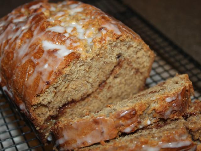 A photograph of a freshly cooked date and walnut loaf.